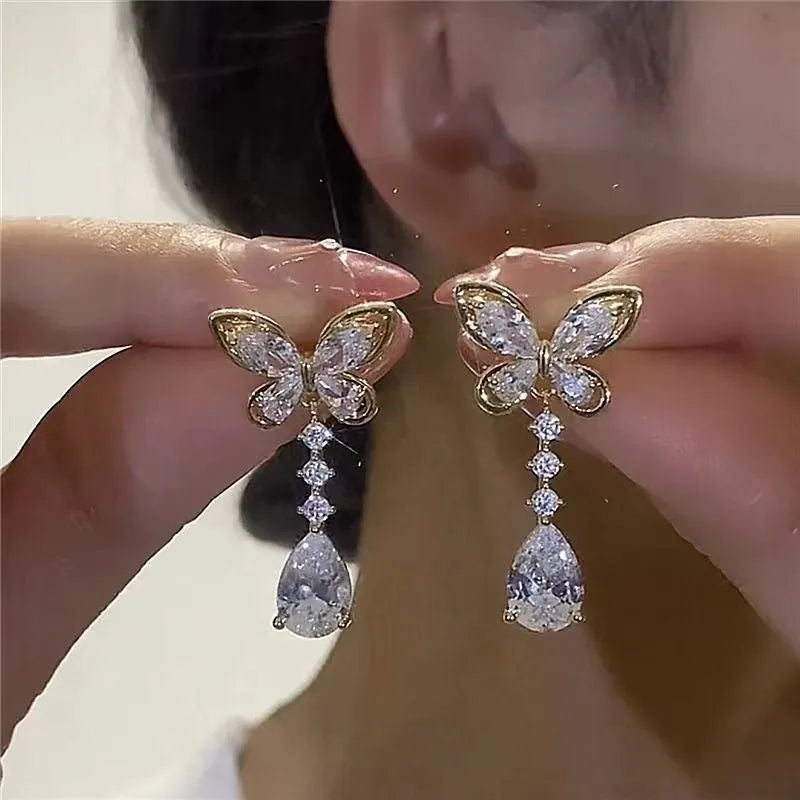 Bow-shaped stud earrings with platinum electroplated finish on zinc alloy for women's jewellery