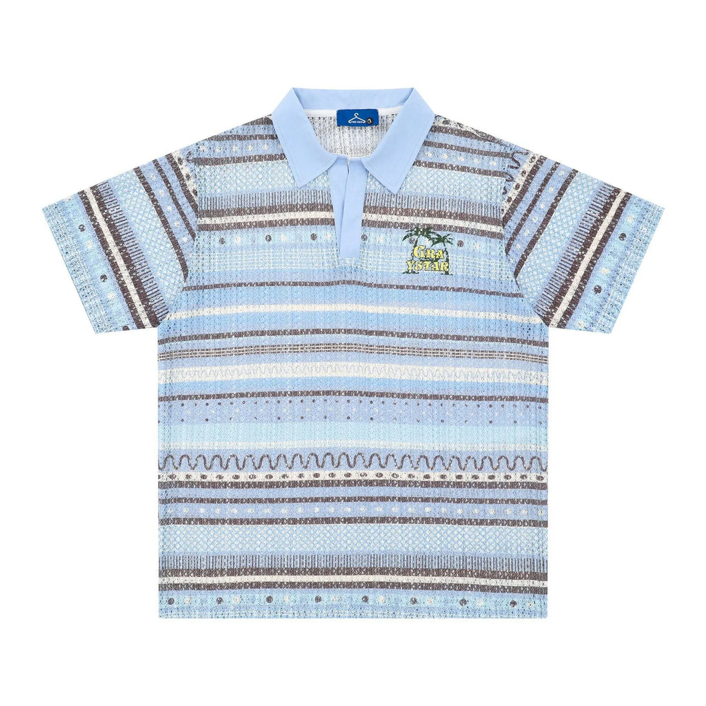 Man wearing a blue printed loose-fit short sleeve casual shirt made from polyester fabric.