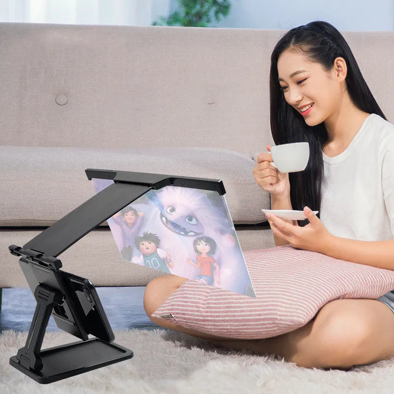 Black L20 split mobile phone screen magnifier with acrylic lens and separate mounting bracket on a table