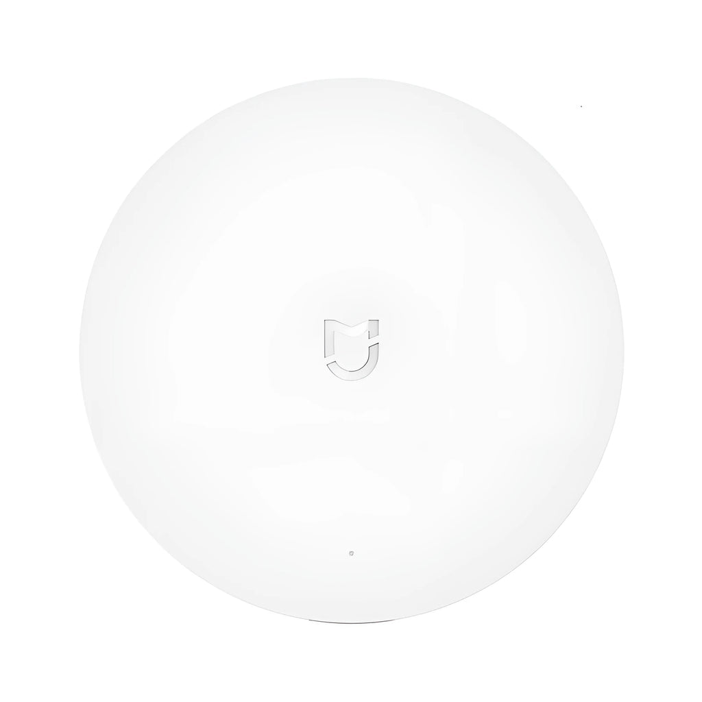 White circular Xiaomijia smart home gateway with UK plug for wireless control of smart home devices