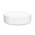 White circular Xiaomijia smart home gateway with UK plug for wireless control of smart home devices