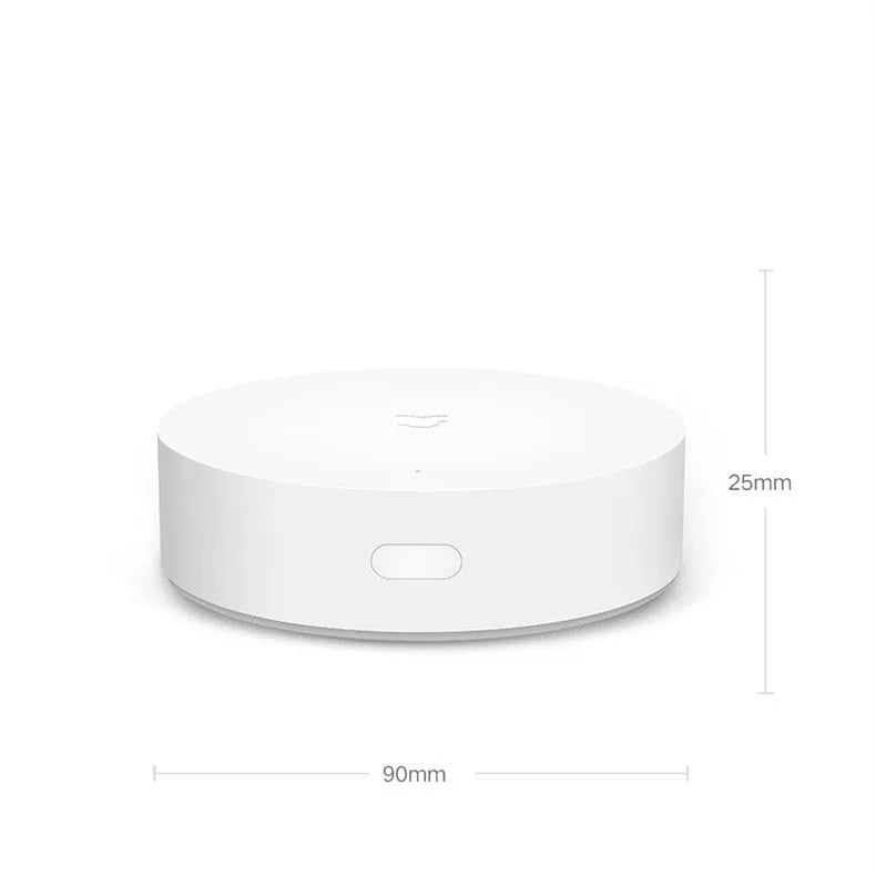 White circular Xiaomijia smart home gateway with UK plug for wireless control of smart home devices