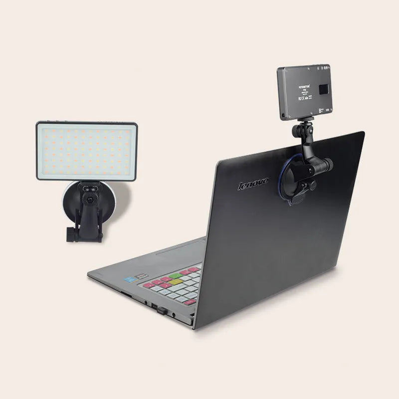 Black aluminium portable LED video light for laptop conferences shown with USB-C cable.