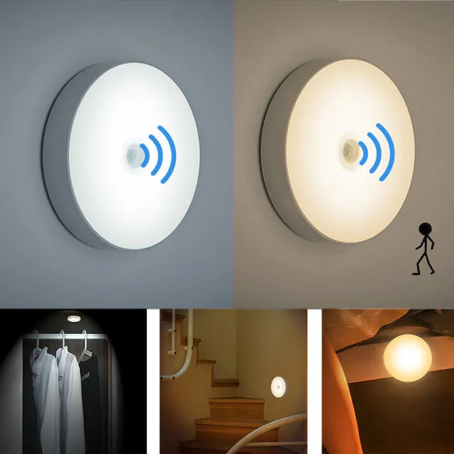 Small white circular USB rechargeable LED motion sensing night light with adhesive backing.