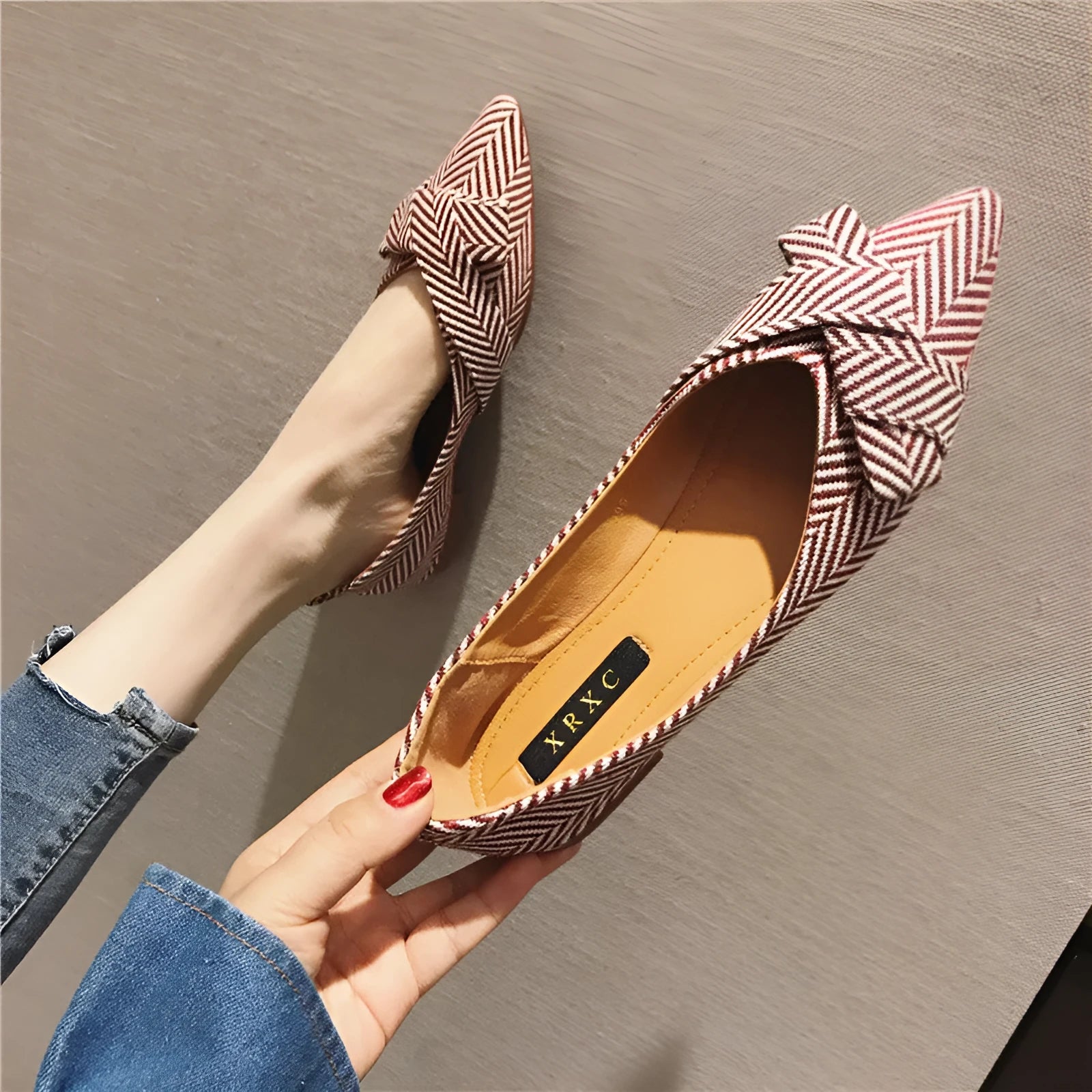 Women's red pointed low-heel shoes with cotton upper and Korean style shallow mouth design on plain background