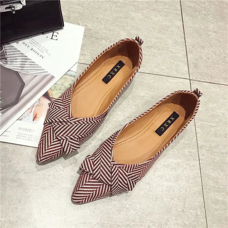 Women's red pointed low-heel shoes with cotton upper and Korean style shallow mouth design on plain background