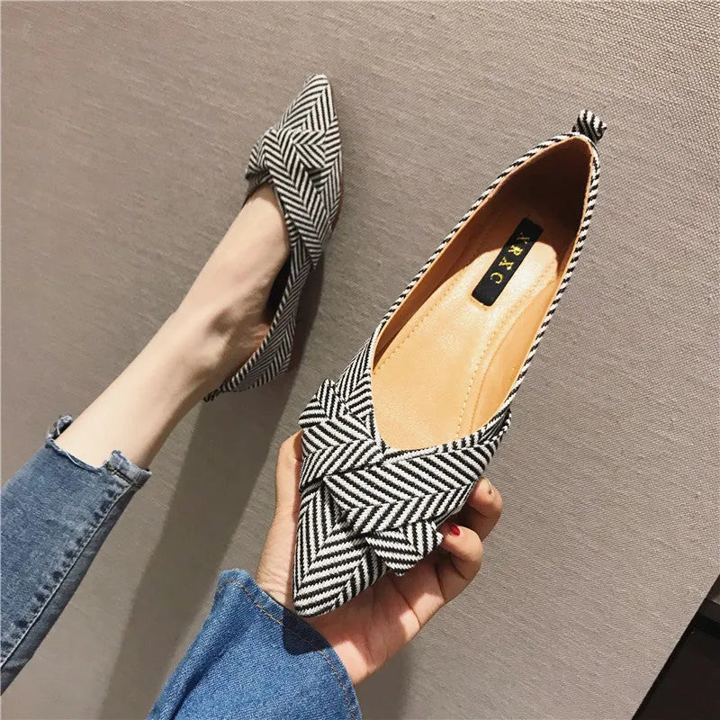 Women's red pointed low-heel shoes with cotton upper and Korean style shallow mouth design on plain background