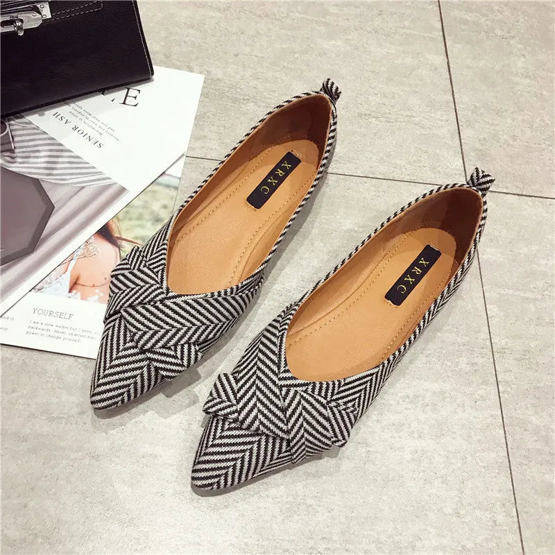 Women's red pointed low-heel shoes with cotton upper and Korean style shallow mouth design on plain background