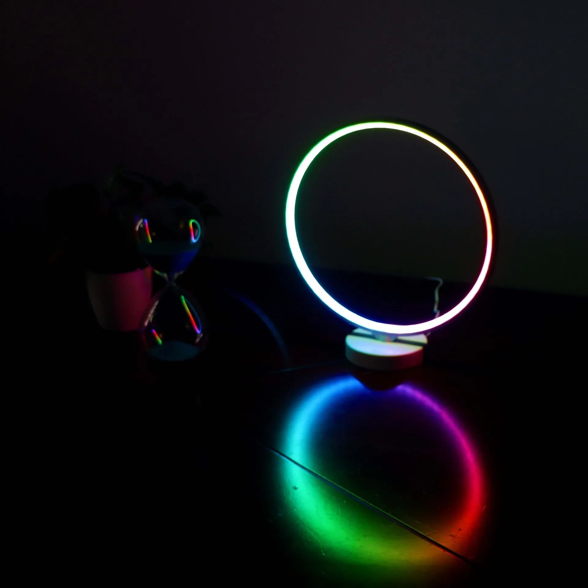 White Full Moon Table Lamp with remote control on a wooden surface