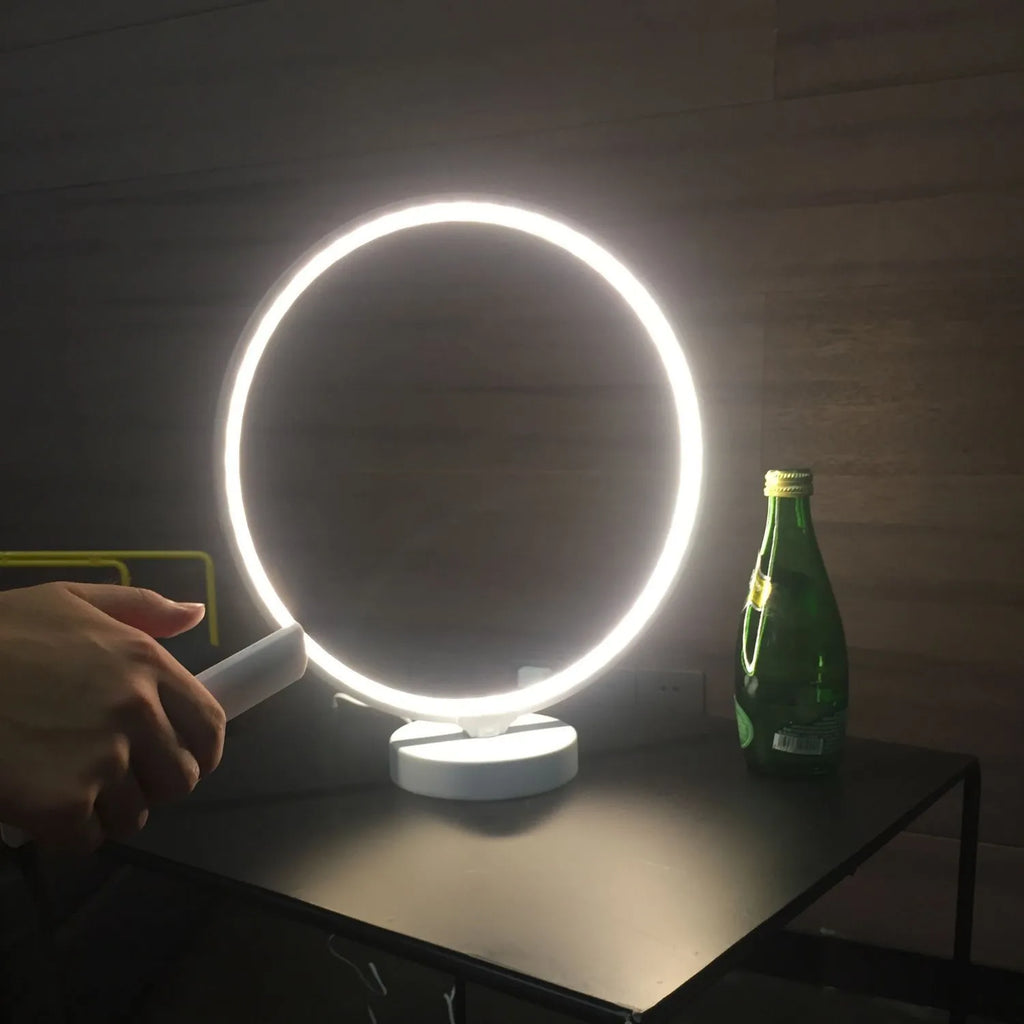 White Full Moon Table Lamp with remote control on a wooden surface