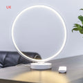 White Full Moon Table Lamp with remote control on a wooden surface