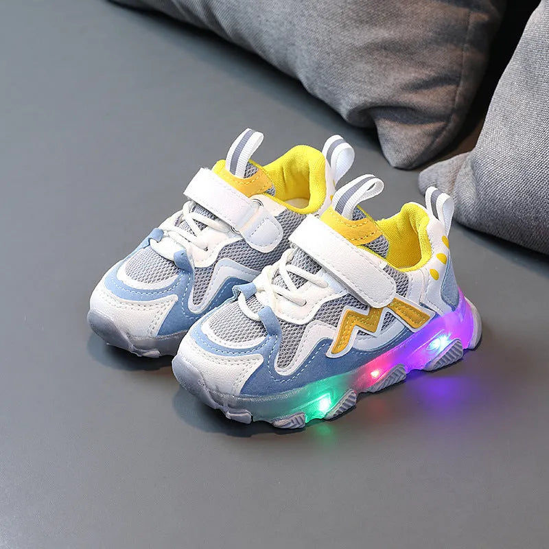 Kids black mesh Velcro sneakers with a rubber sole on a white background.