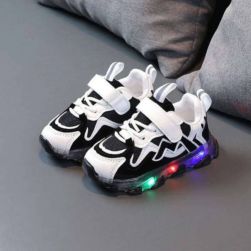 Kids black mesh Velcro sneakers with a rubber sole on a white background.