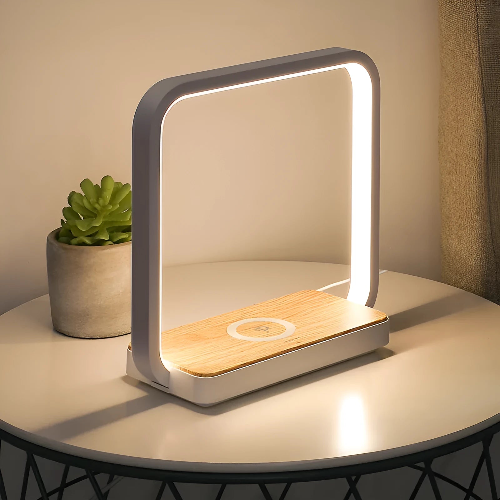 White modern smart bedside lamp with touch sensor and voice control on a wooden table.