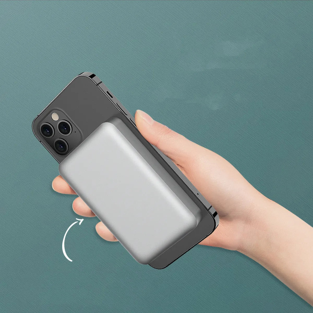 Silver aluminium magnetic wireless power bank next to a mobile phone, showing slim 12mm profile.