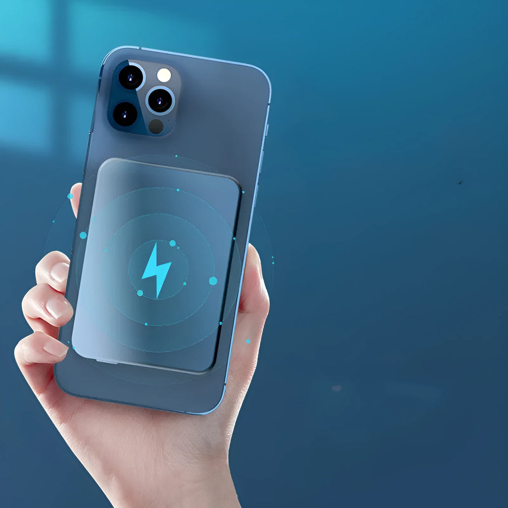 Silver aluminium magnetic wireless power bank next to a mobile phone, showing slim 12mm profile.