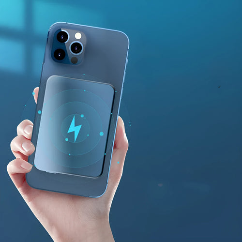 Silver aluminium magnetic wireless power bank next to a mobile phone, showing slim 12mm profile.