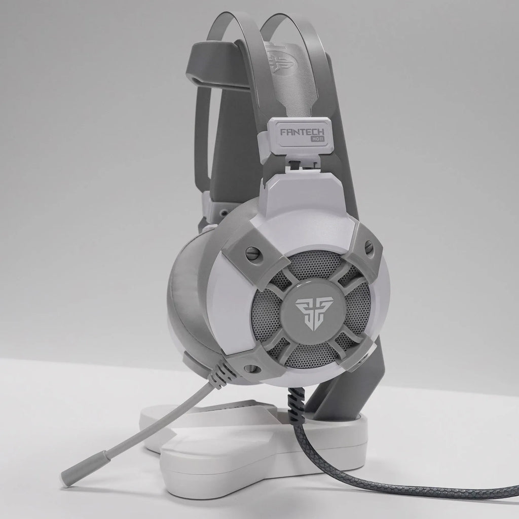 Black FANTECH HG11 USB gaming headset with RGB lights on ear cups and a cable with remote control.