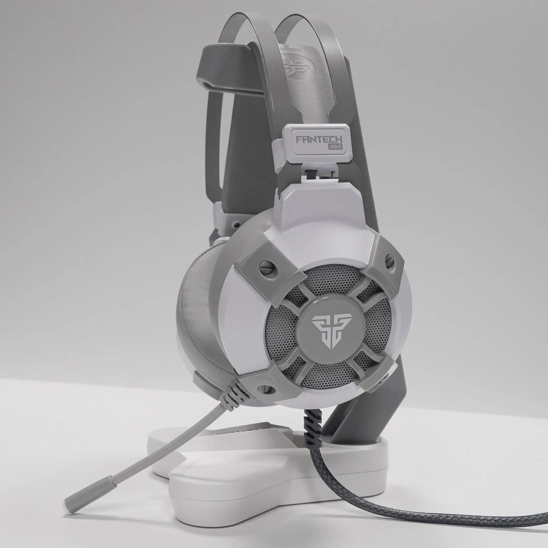 Black FANTECH HG11 USB gaming headset with RGB lights on ear cups and a cable with remote control.