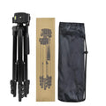 Black portable camera tripod extended to maximum height with quick-release plate