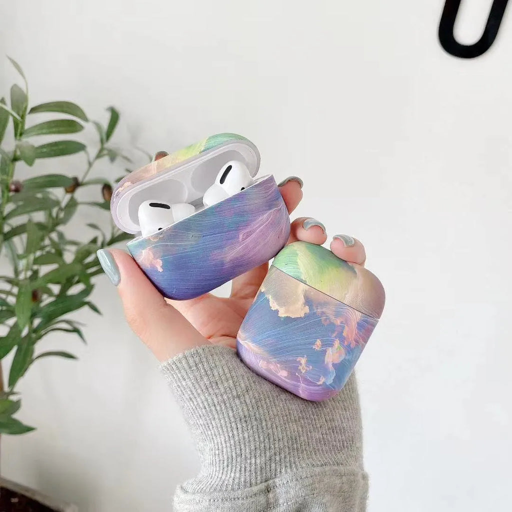 Hard plastic protective sleeve for Apple AirPods case in pink watercolour design.