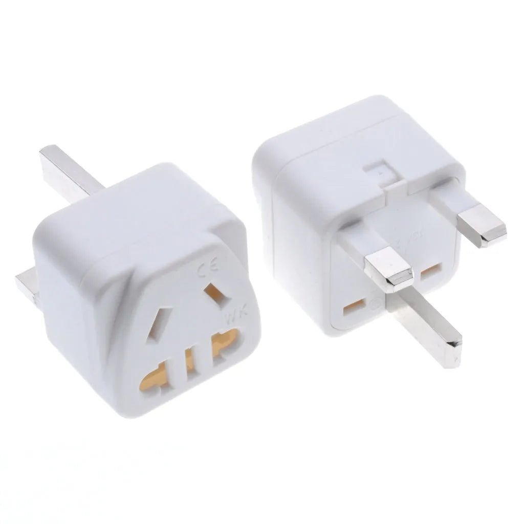 White international travel adapter converting UK US EU AU plugs to UK 3-pin sockets with five output ports