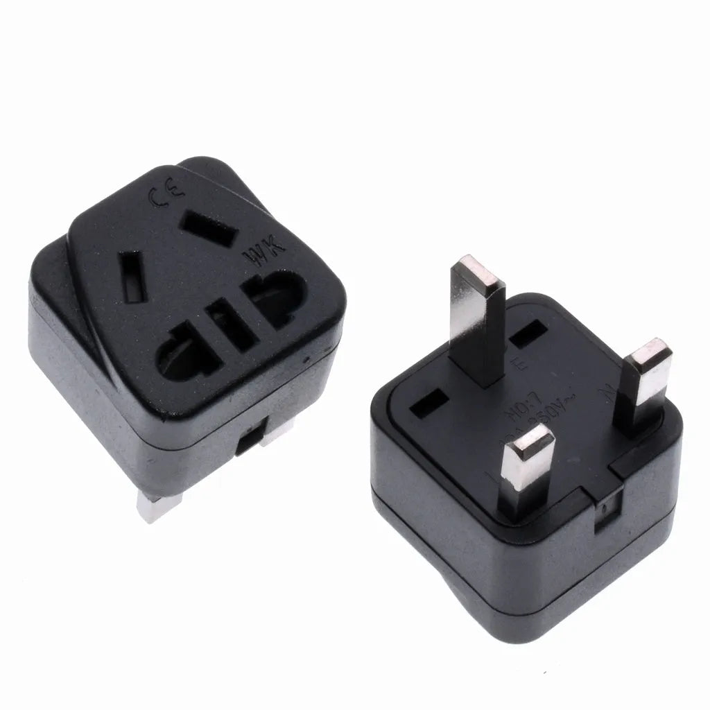 White international travel adapter converting UK US EU AU plugs to UK 3-pin sockets with five output ports