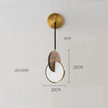 Modern long-line wooden chandelier with carved walnut body mounted on a wall