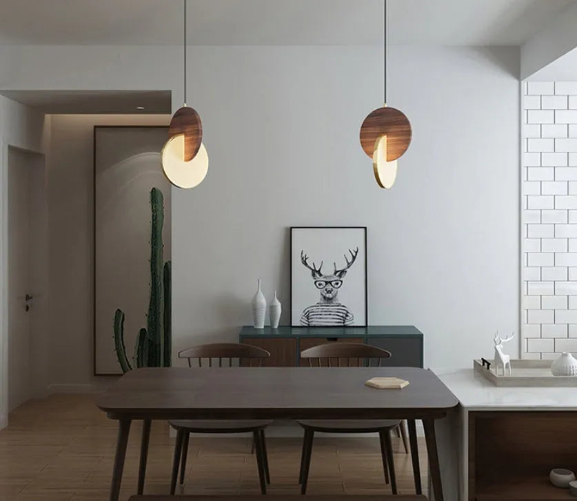 Modern long-line wooden chandelier with carved walnut body mounted on a wall