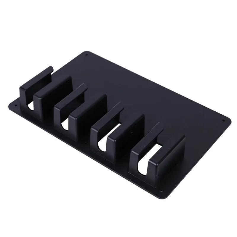Black plastic clipper frame holding four electric hair clippers with wall-mounting screws