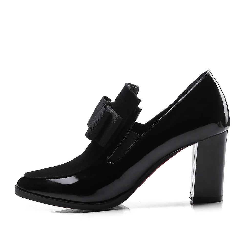 Women's black leather high heels with a thick square heel over 8cm and a square toe.