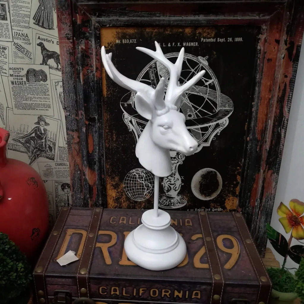 Woodland animal resin sculpture home decoration in black, white, and wood colour finishes.