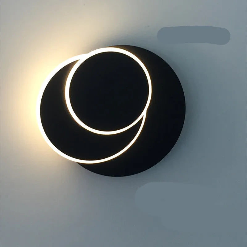Modern round wall lamp with acrylic shade in black or white colour options