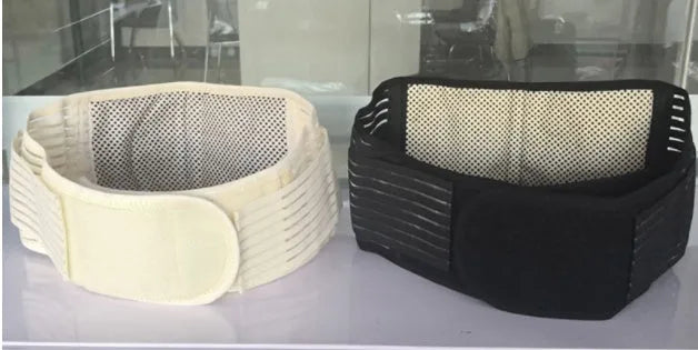 A black self-heating waist protection belt with a magnetic closure, laid flat.