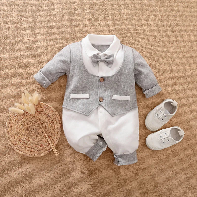 Long-sleeved cotton baby jumpsuit for boys in navy blue gentleman style, suitable for newborns and infants.