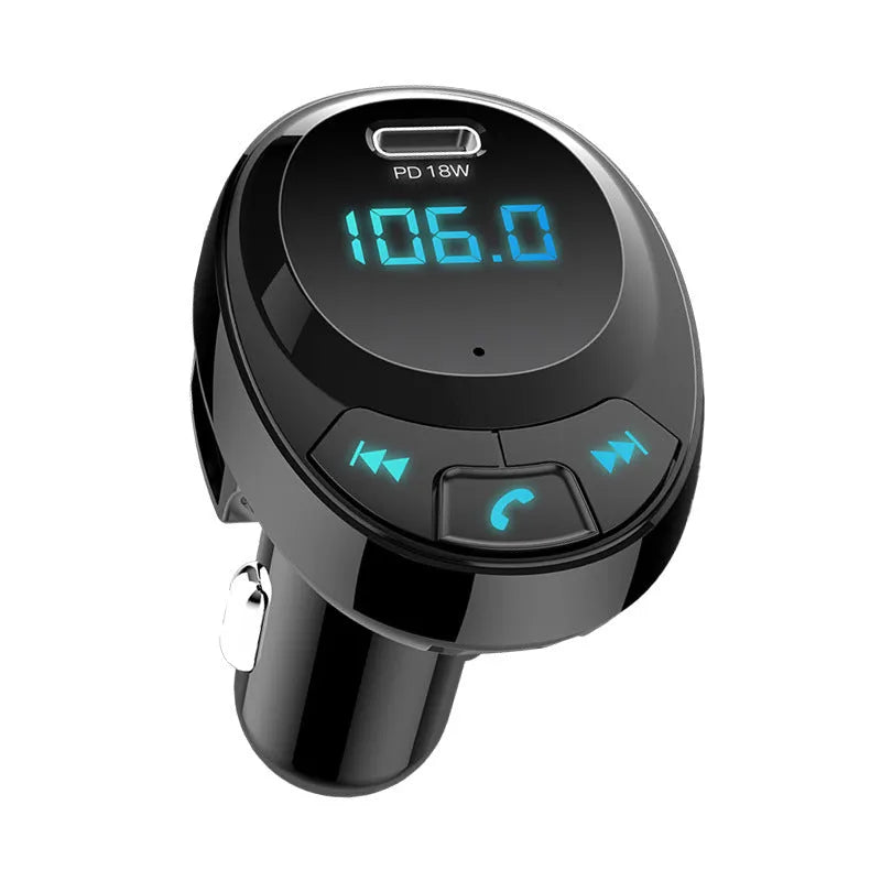 Black car Bluetooth MP3 charger with digital display and dual USB ports plugged into a car cigarette lighter.