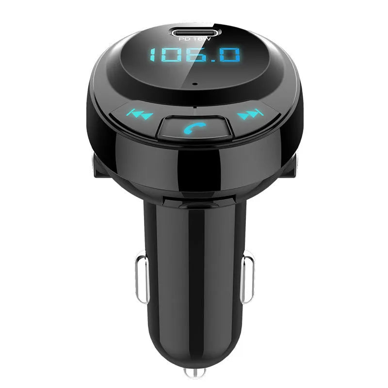 Black car Bluetooth MP3 charger with digital display and dual USB ports plugged into a car cigarette lighter.