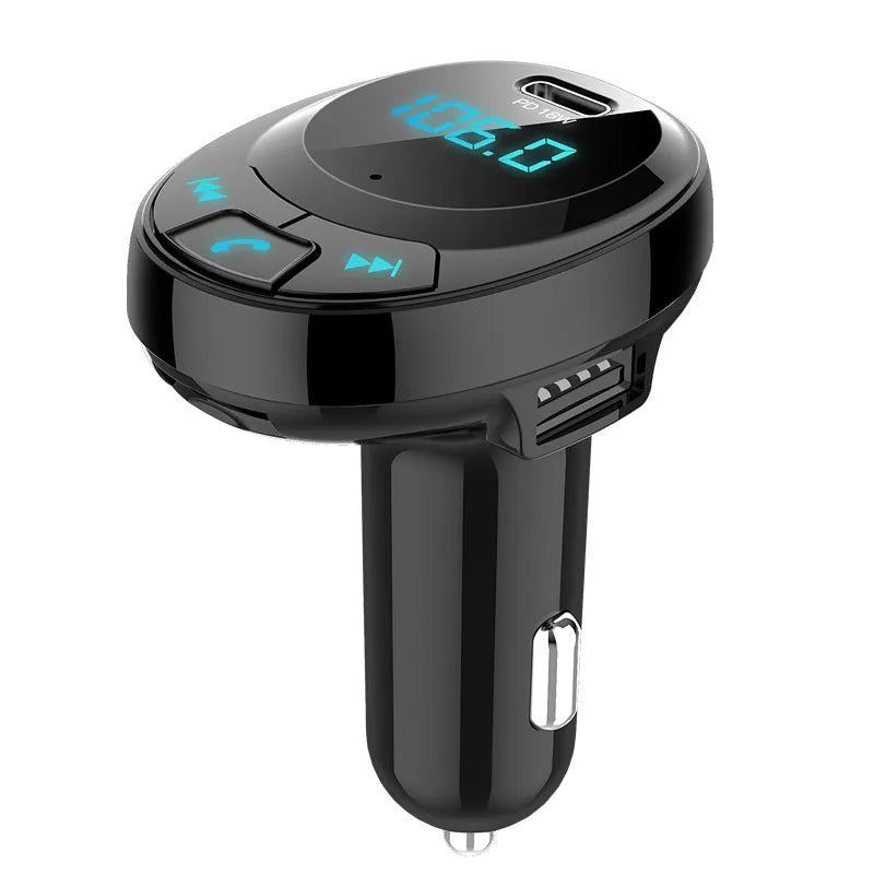 Black car Bluetooth MP3 charger with digital display and dual USB ports plugged into a car cigarette lighter.