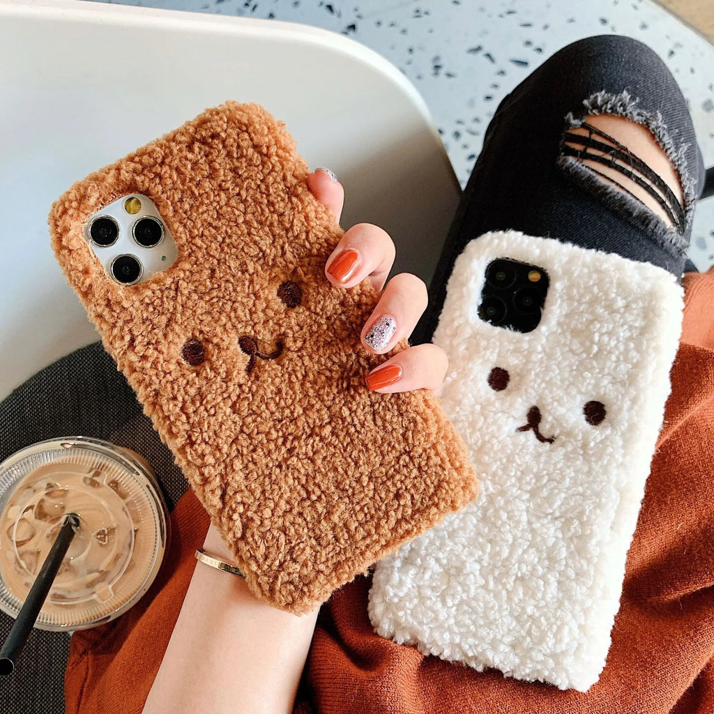 Brown embroidered plush cartoon bear face on a soft TPU iPhone phone case.