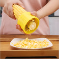 Yellow manual corn grinder thresher with corn-shaped design and stainless steel gear
