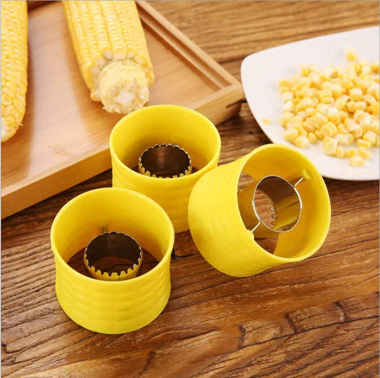 Yellow manual corn grinder thresher with corn-shaped design and stainless steel gear