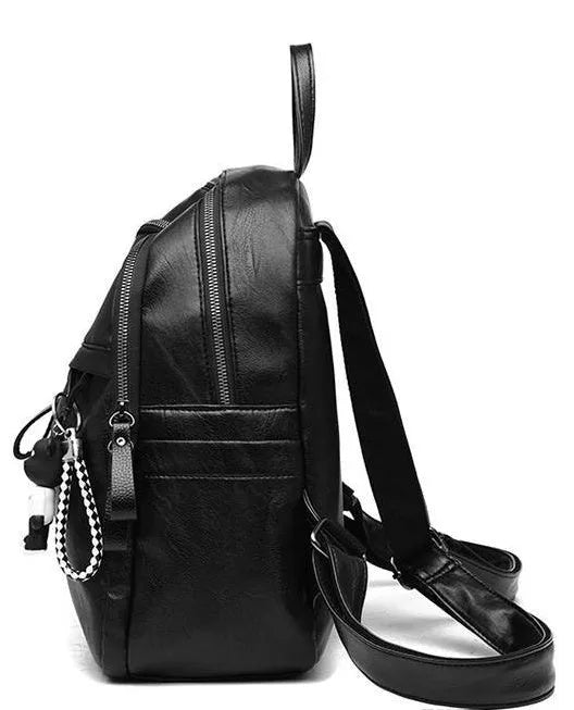 Black soft PU leather medium backpack with two shoulder straps, shown closed.