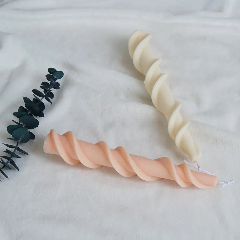 Handmade silicone screw wax mould for creating spiral lace pattern candles in assorted colours