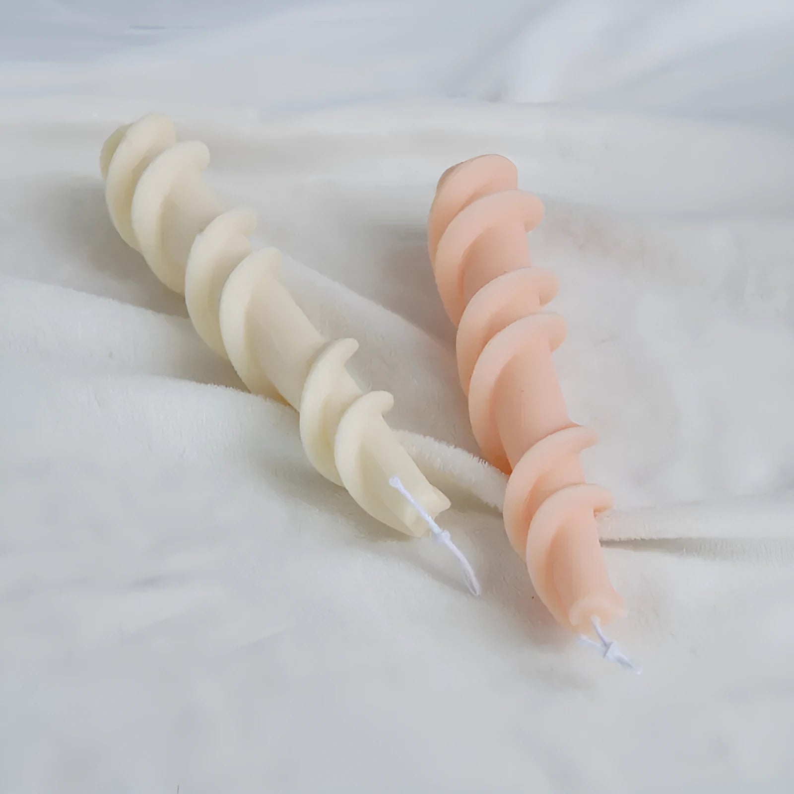 Handmade silicone screw wax mould for creating spiral lace pattern candles in assorted colours