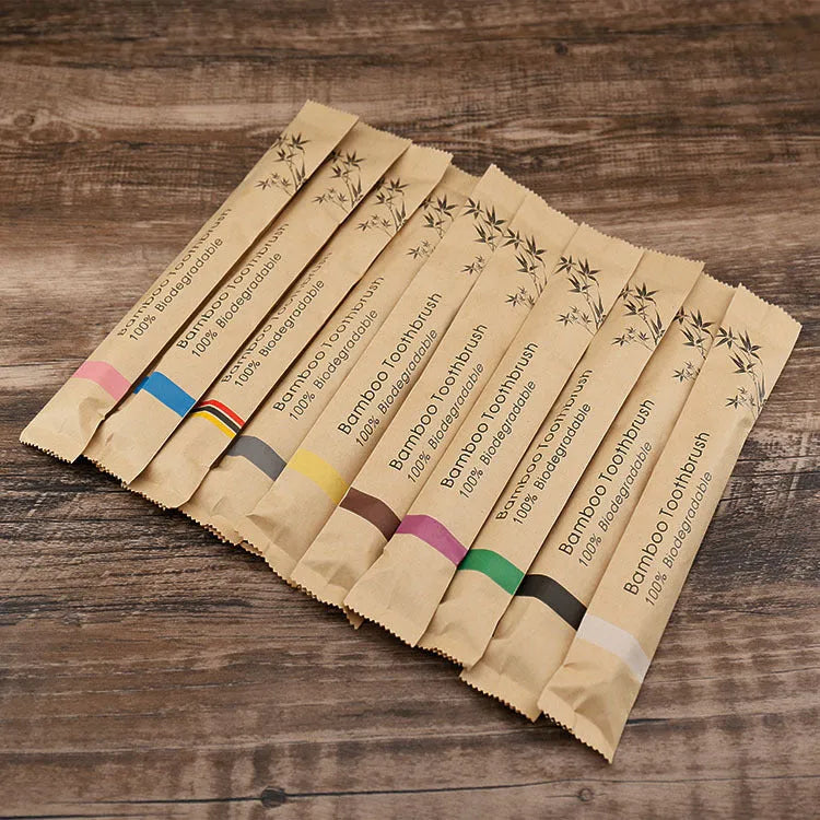 10 bamboo toothbrushes with charcoal bristles in black, green, purple, yellow, white and grey colours