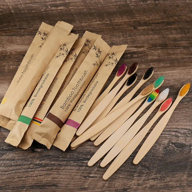 10 bamboo toothbrushes with charcoal bristles in black, green, purple, yellow, white and grey colours