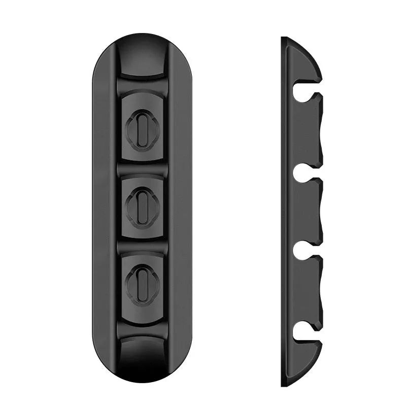 Black soft plastic desktop magnetic charging cable organiser with multiple cable slots
