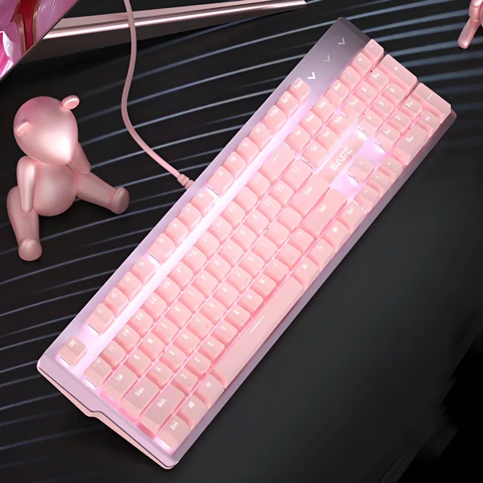 Pink mechanical keyboard and matching wired gaming mouse set on desktop