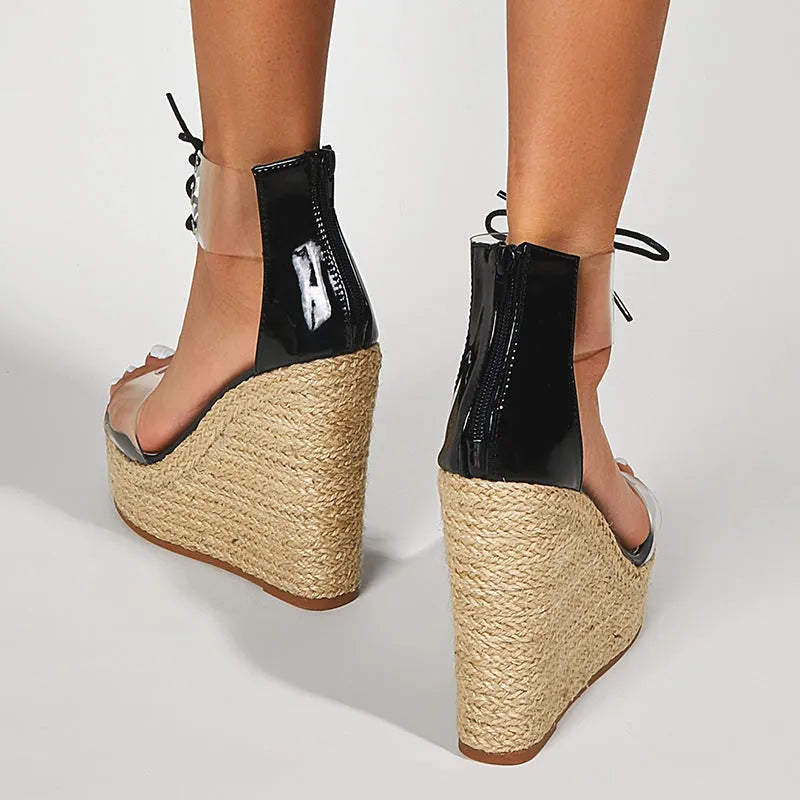 Black women's wedge sandals with hemp rope texture on 8cm heel and front tie closure.