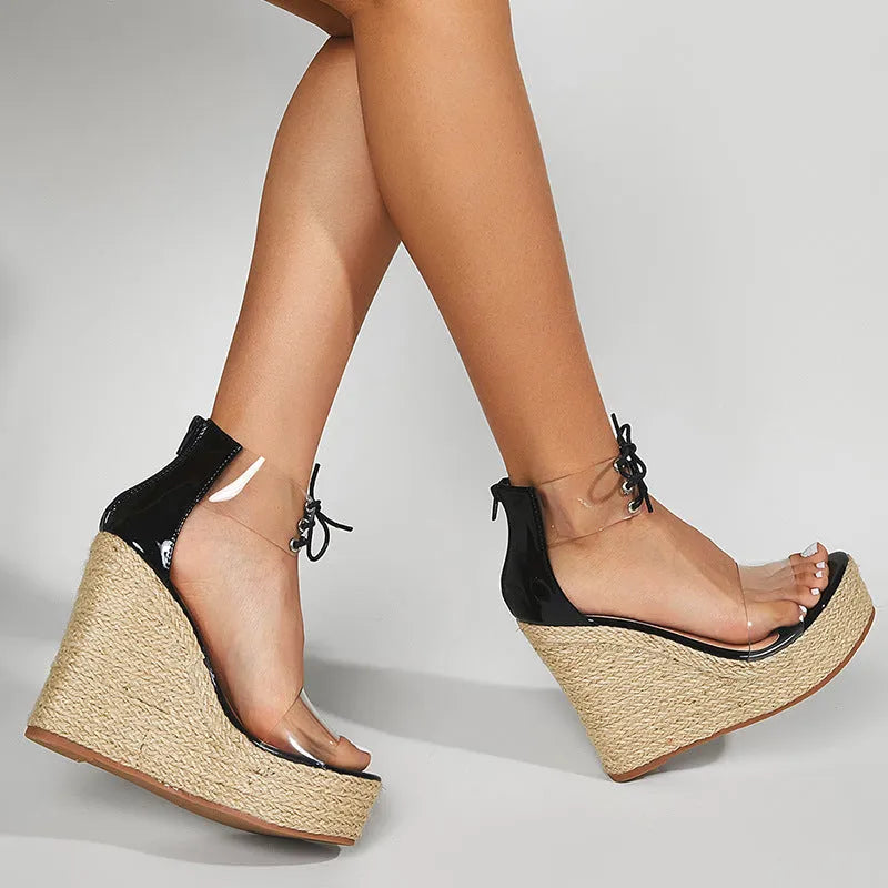 Black women's wedge sandals with hemp rope texture on 8cm heel and front tie closure.